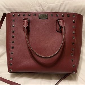 Burgundy bag with black studs